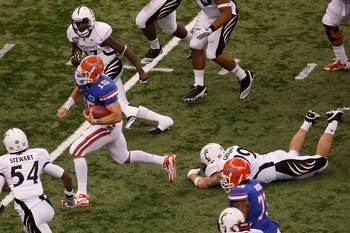 NEW ORLEANS - JANUARY 01:  Tim Tebow #15 of the Florida Gators runs through the defense of the Cincinnati Bearcats during the Allstate Sugar Bowl at the Louisana Superdome on January 1, 2010 in New Orleans, Louisiana.  (Photo by Chris Graythen/Getty Image