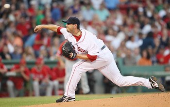 BOSTON - AUGUST 19:  Josch Beckett #19 of the Boston Red Sox delivers a pitch in the first inning against the Los Angeles Angels of Anaheim on August 19, 2010 at Fenway Park in Boston, Massachusetts.  (Photo by Elsa/Getty Images)