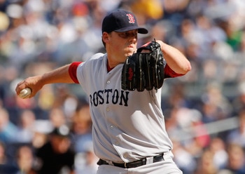 NEW YORK - AUGUST 07:  John Lackey #40 of the Boston Red Sox delivers a pitch in the first-inning against the New York Yankees on August 7, 2010 at Yankee Stadium in the Bronx borough of New York City.  (Photo by Mike Stobe/Getty Images)