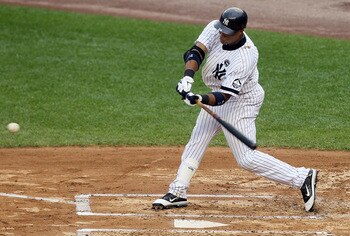 NEW YORK - AUGUST 22:  Robinson Cano #24 of the New York Yankees connects on a sixth inning two run base hit against the Seattle Mariners on August 22, 2010 at Yankee Stadium in the Bronx borough of New York City.The Yankees defeated the Mariners 10-0.  (