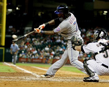 HOUSTON - AUGUST 19:  Jose Reyes #7 of the New York Mets singles up the middle in the eighth inning against the Houston Astros at Minute Maid Park on August 19, 2010 in Houston, Texas.  (Photo by Bob Levey/Getty Images)