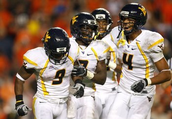 AUBURN, AL - SEPTEMBER 19:  Jock Sanders #9, Noel Devine #7 and Wes Lyons #4 of the West Virginia Mountaineers against the Auburn Tigers at Jordan-Hare Stadium on September 19, 2009 in Auburn, Alabama.  (Photo by Kevin C. Cox/Getty Images)