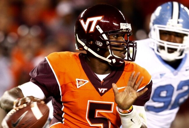 BLACKSBURG, VA - OCTOBER 29:  Quarterback Tyrod Taylor #5 of the Virginia Tech University Hokies looks to pass the ball against E.J. Wilson #92 of the North Carolina Tar Heels during the first quarter of the game at Lane Stadium on October 29, 2009 in Bla