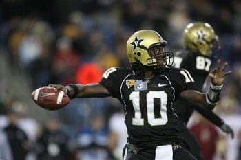 NASHVILLE, TN - DECEMBER 31:  Larry Smith #10 of the Vanderbilt Commodores passes against the Boston College Eagles during the Gaylord Hotels Music City Bowl at LP Field on December 31, 2008 in Nashville, Tennessee.  (Photo by Andy Lyons/Getty Images)