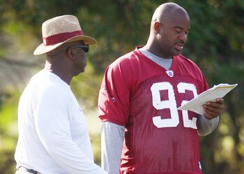 Albert Haynesworth practicing holding a clipboard for when he gets hurt.