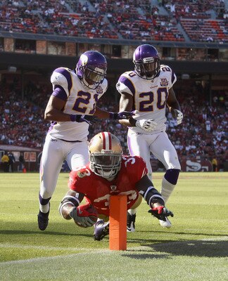 Anthony Dixon beats the defense to the pylon to score a first-quarter touchdown on Sunday.