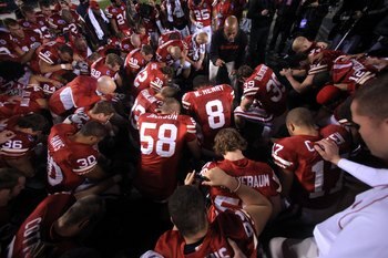 SAN DIEGO - DECEMBER 30:  Members of the University of Nebraska Cornhuskers pray on field after their 33-0 victory against the against the University of Arizona Wildcats during the Pacific Life Holiday Bowl, on December 30, 2009 at Qualcomm Stadium in San