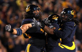 BERKELEY, CA - SEPTEMBER 05:  Tyson Alualu #44, Cameron Jordan #97, and Syd'quan Thompson #5 of the California Golden Bears celebrate after they caused a fumble during the first half of their game against the Maryland Terrapins at California Memorial Stad
