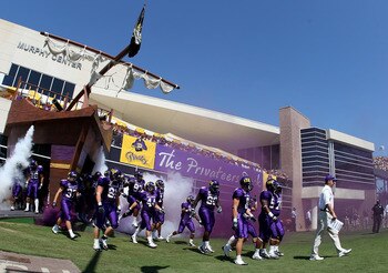 GREENVILLE, NC - SEPTEMBER 05:  Head coach Skip Holtz of the East Carolina Pirates walks onto the field with his team before their game against the Appalachian State Mountaineers at Dowdy-Ficklen Stadium on September 5, 2009 in Greenville, North Carolina.