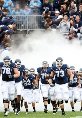 EAST HARTFORD, CT - SEPTEMBER 12:  The Connecticut Huskies enter the field before the game against  the North Carolinia Tar Heels on September 12, 2009 at Rentschler Field in East Hartford, Connecticut.  (Photo by Elsa/Getty Images)