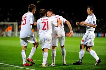 LYON, FRANCE - APRIL 27:  Ivica Olic (2nd R) of Bayern Muenchen celebrates with Philipp Lahm and teammates after scoring his team's third goal during the UEFA Champions League semi final second leg match between Olympique Lyonnais and Bayern Muenchen at t