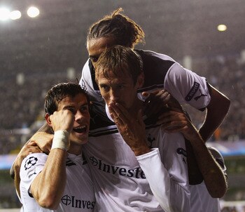 LONDON, ENGLAND - AUGUST 25:  Peter Crouch of Tottenham Hotspur celebrates with team mates as he scores their thrid goal during the UEFA Champions League play-off second leg match between Tottenham Hotspur and BSC Young Boys at White Hart Lane on August 2