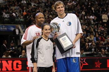 DALLAS - FEBRUARY 13:  TNT analyst Kenny Smith #30 formerly of the Houston Rockets, Becky Hammon #25 and Dirk Nowitzki #41 of the Dallas Mavericks, all of team Texas, hold the Champions Trophy after winning the Haier Shooting Stars Competition on All-Star