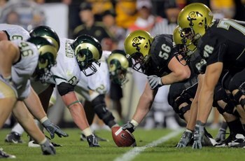 BOULDER, CO - SEPTEMBER 06:  Center Keenan Stevens #56 of the Colorado Buffaloes prepares to snap the ball on the line of scrimmage against the Colorado State Rams at Folsom Field on September 6, 2009 in Boulder, Colorado. The Rams defeated the Buffaloes 