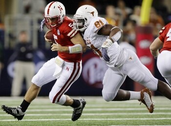ARLINGTON, TX - DECEMBER 5: Quarterback Zac Lee of the Nebraska Cornhuskers is sacked by Sam Acho #81 of the Texas Longhorns at Cowboys Stadium on December 5, 2009 in Arlington, Texas. (Photo by Jamie Squire/Getty Images)