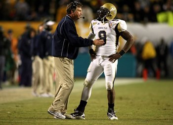 MIAMI GARDENS, FL - JANUARY 05:  Head coach Paul Johnson of the Georgia Tech Yellow Jackets talks with quarterback Josh Nesbitt #9 against the Iowa Hawkeyes during the FedEx Orange Bowl at Land Shark Stadium on January 5, 2010 in Miami Gardens, Florida.  