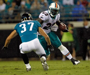 JACKSONVILLE, FL - AUGUST 21:  Ronnie Brown #23 of the Miami Dolphins attempts to run past Sean Considine #37 of the Jacksonville Jaguars during the preseason game at EverBank Field on August 21, 2010 in Jacksonville, Florida.  (Photo by Sam Greenwood/Get