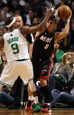 BOSTON - APRIL 17:  Carlos Arroyo #8 of the Miami Heat tries to pass as Rajon Rondo #9  of the Boston Celtics defends during Game One of the Eastern Conference Quarterfinals of the 2010 NBA playoffs at the TD Garden on April 17, 2010 in Boston, Massachuse