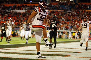 MIAMI - JANUARY 01:  Darren Evans #32 of the Virginia Tech Hokies celebrates after scoring a touchdown during the FedEx Orange Bowl against the Cincinnati Bearcats at Dolphin Stadium on January 1, 2009 in Miami, Florida.  (Photo by Streeter Lecka/Getty Im