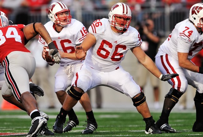 COLUMBUS, OH - OCTOBER 10:  Offensive lineman Peter Konz #66 of the Wisconsin Badgers blocks against the Ohio State Buckeyes at Ohio Stadium on October 10, 2009 in Columbus, Ohio.  (Photo by Jamie Sabau/Getty Images)
