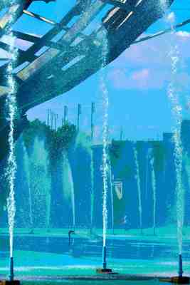 A place of cool waters sets off the grandeur of Arthur Ashe in the distance