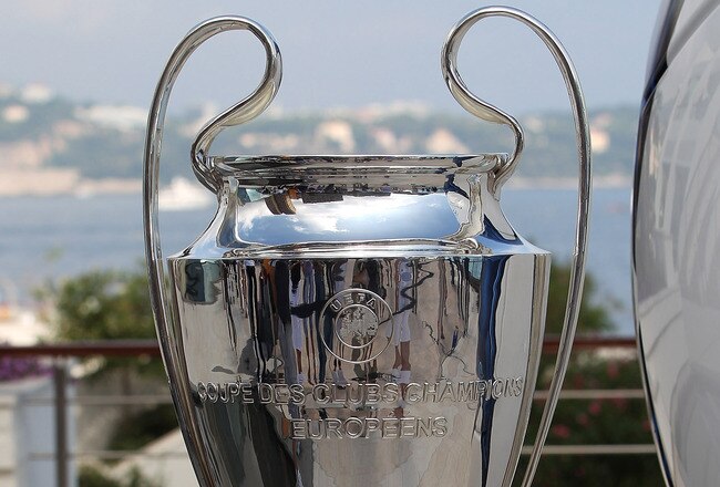 MONACO - AUGUST 26:  An Adidas ball on show alongside the Champions League trophy during the UEFA Champions League Group Stage draw at the Grimaldi Forum on August 26, 2010 in Monaco, Monaco.  (Photo by Michael Steele/Getty Images)