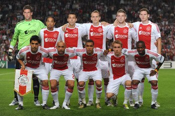 AMSTERDAM, NETHERLANDS - AUGUST 25: Members of the Ajax team (L-R back row) Maarten Stekelenburg, Urby Emanuelson, Mounir El Hamdaoui, Siem De Jong, Toby Alderweireld, Jan Vertonghen, (L-R front row) Luis Suarez, Demy De Zeeuw,  Gregory Van Der Wiel, Chri