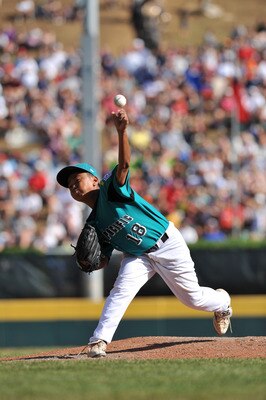 WILLIAMSPORT, PA - AUGUST 30: Starting pitcher Chin Ou of Asia Pacific (Taoyuan, Taiwan) pitches against California (Chula Vista) in the little league world series final at Lamade Stadium on August 30, 2009 in Williamsport, Pennsylvania. (Photo by Larry F