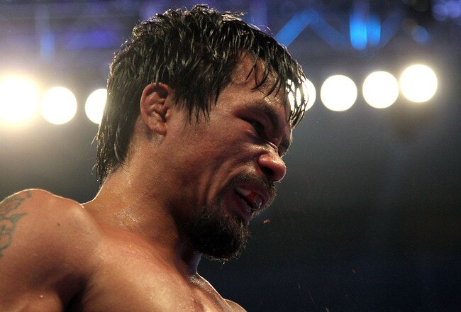 ARLINGTON, TX - MARCH 13:  Manny Pacquiao of the Philippines looks on in the ring against Joshua Clottey of Ghana during the WBO welterweight title fight at Cowboys Stadium on March 13, 2010 in Arlington, Texas. Pacquiao defeated Clottey by unanimous deci