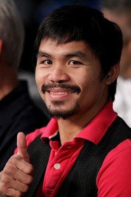 NEW YORK - JUNE 05:  Professional boxer Manny Pacquiao watches the bout between Yuri Foreman and Miguel Cotto of Puerto Rico in the WBA world super welterweight title fight on June 5, 2010 at Yankee Stadium in the Bronx borough of New York City. Cotto win