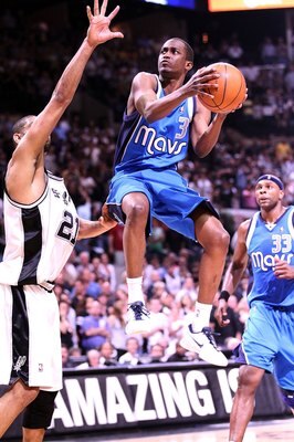 SAN ANTONIO - APRIL 23:  Guard Rodrigue Beaubois #3 of the Dallas Mavericks takes a shot against Tim Duncan #21 of the San Antonio Spurs in Game Three of the Western Conference Quarterfinals during the 2010 NBA Playoffs at AT&T Center on April 23, 2010 in