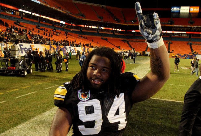 MIAMI GARDENS, FL - JANUARY 05:  Adrian Clayborn #94 of the Iowa Hawkeyes celebrates as he walks off the field after their 24-14 win against the Georgia Tech Yellow Jackets during the FedEx Orange Bowl at Land Shark Stadium on January 5, 2010 in Miami Gar