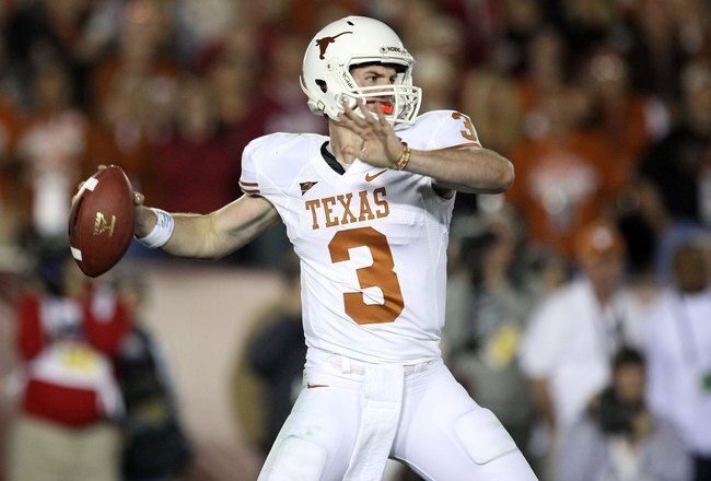 PASADENA, CA - JANUARY 07:  Quarterback Garrett Gilbert #3 of the Texas Longhorns drops back to pass against the Alabama Crimson Tide during the Citi BCS National Championship game at the Rose Bowl on January 7, 2010 in Pasadena, California.  (Photo by St