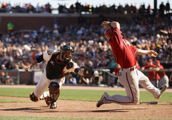 SAN FRANCISCO - AUGUST 29:  Gerardo Parra #18 of the Arizona Diamondbacks safely gets around the tag of Eli Whiteside #22 of the San Francisco Giants in the eighth inning at AT&T Park on August 29, 2010 in San Francisco, California. Parra slide past home