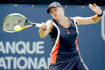 MONTREAL, QC - AUGUST 18:  Alisa Kleybanova of Russia returns a shot to Flavia Pennetta of Italy during the Rogers Cup at Stade Uniprix on August 18, 2010 in Montreal, Canada.  (Photo by Matthew Stockman/Getty Images)