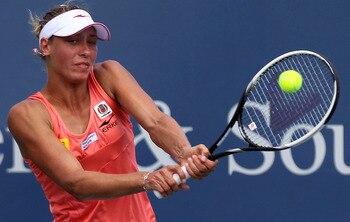 CINCINNATI - AUGUST 13:  Yanina Wickmayer of Belgium hits a backhand return during her quarter final match with Anastasia Pavlyuchenkova of Russia on day five of the Western & Southern Financial Group Women's Open on August 13, 2010 at the Lindner Family