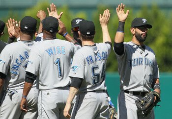 ANAHEIM, CA - AUGUST 15:  Jose Bautistal (R) #19 and Jason Frasor #54 of the Toronto Blue Jays congratulate each other following their teams victory over the Los Angeles Angels of Anaheim at Angel Stadium on August 15, 2010 in Anaheim, California. The Blu