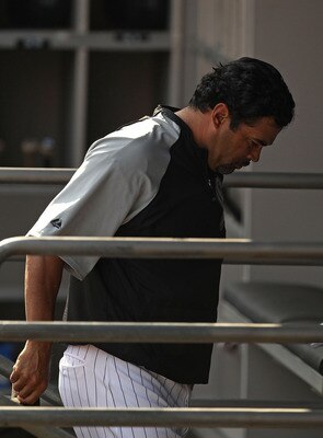 CHICAGO - AUGUST 29: Manager Ozzie Guillen #13 of the Chicago White Sox heads to the locker room after being thrown out of a game against the New York Yankees in the 9th inning at U.S. Cellular Field on August 29, 2010 in Chicago, Illinois. The Yankees de
