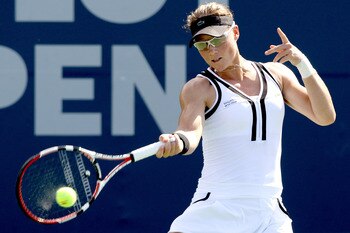 NEW HAVEN, CT - AUGUST 26:  Samantha Stosur of Australia returns a shot to Nadia Petrova of Russia during the Pilot Pen tennis tournament at the Connecticut Tennis Center on August 26, 2010 in New Haven, Connecticut.  (Photo by Matthew Stockman/Getty Imag