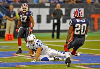 TORONTO - AUGUST 19:  Jacob Tamme #84 the Indianapolis Colts scores a first half touch down with George Wilson #37 and Donte Whitner #20 of the buffalo Bills defending during game action August 19, 2010 at the Rogers Centre in Toronto, Ontario, Canada. (P