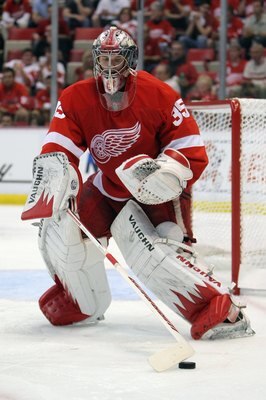DETROIT - MAY 4:  Jimmy Howard #35 of the Detroit Red Wings defends the net against the San Jose Sharks in Game Three of the Western Conference Semifinals during the 2010 Stanley Cup Playoffs at Joe Louis Arena on May 4, 2010 in Detroit, Michigan. (Photo