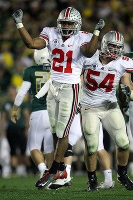 John Simon, #54 on the right, is expected to be a very talented player in the middle of the Ohio State defenslive line.
