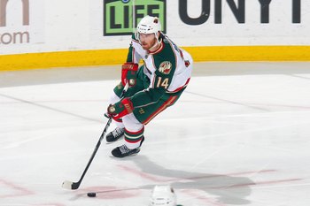 BUFFALO, NY - MARCH 12: Martin Havlat #14 of the Minnesota Wild handles the puck during the game against the Buffalo Sabres at HSBC Arena on March 12, 2010 in Buffalo, New York. (Photo by Rick Stewart/Getty Images)