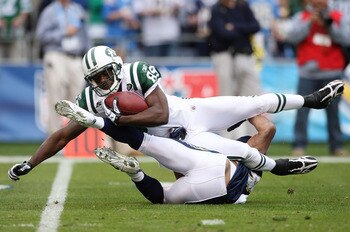 SAN DIEGO - JANUARY 17:  Wide receiver Jerricho Cotchery #89 of the New York Jets is tackled after making a catch against the San Diego Chargers during the AFC Divisional Playoff Game at Qualcomm Stadium on January 17, 2010 in San Diego, California.  (Pho