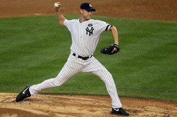 NEW YORK - AUGUST 22:  Kerry Wood #39 of the New York Yankees pitches against the Seattle Mariners on August 22, 2010 at Yankee Stadium in the Bronx borough of New York City.The Yankees defeated the Mariners 10-0.  (Photo by Jim McIsaac/Getty Images)