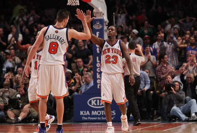 NEW YORK - MARCH 19: Toney Douglas #23 of the New York Knicks celebrates a basket with teammate Danilo Gallinari #8 against the Philadelphia 76ers at Madison Square Garden on March 19, 2010 in New York City. NOTE TO USER: User expressly acknowledges and a