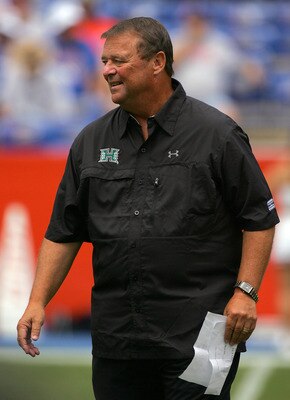 GAINESVILLE, FL - AUGUST 30:  Head coach Greg McMackin of the Hawaii Warriors sends in signals during the game against the Florida Gators at Ben Hill Griffin Stadium on August 30, 2008 in Gainesville, Florida.  (Photo by Sam Greenwood/Getty Images)