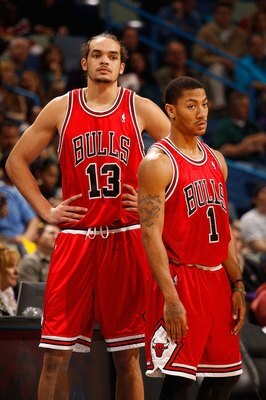 NEW ORLEANS - JANUARY 29:  Joakim Noah #13 and Derrick Rose #1 of the Chicago Bulls during the game against the New Orleans Hornets at the New Orleans Arena on January 29, 2010 in New Orleans, Louisiana.   NOTE TO USER: User expressly acknowledges and agr