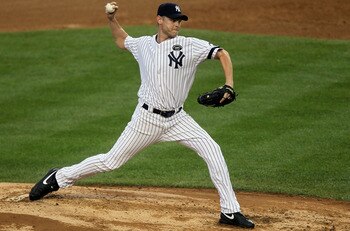 NEW YORK - AUGUST 22:  Kerry Wood #39 of the New York Yankees pitches against the Seattle Mariners on August 22, 2010 at Yankee Stadium in the Bronx borough of New York City.The Yankees defeated the Mariners 10-0.  (Photo by Jim McIsaac/Getty Images)