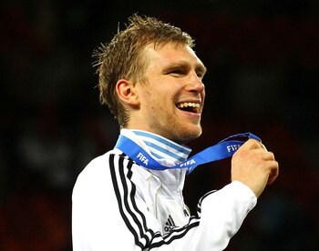PORT ELIZABETH, SOUTH AFRICA - JULY 10:  Per Mertesacker of Germany celebrates victory and third place following the 2010 FIFA World Cup South Africa Third Place Play-off match between Uruguay and Germany at The Nelson Mandela Bay Stadium on July 10, 2010